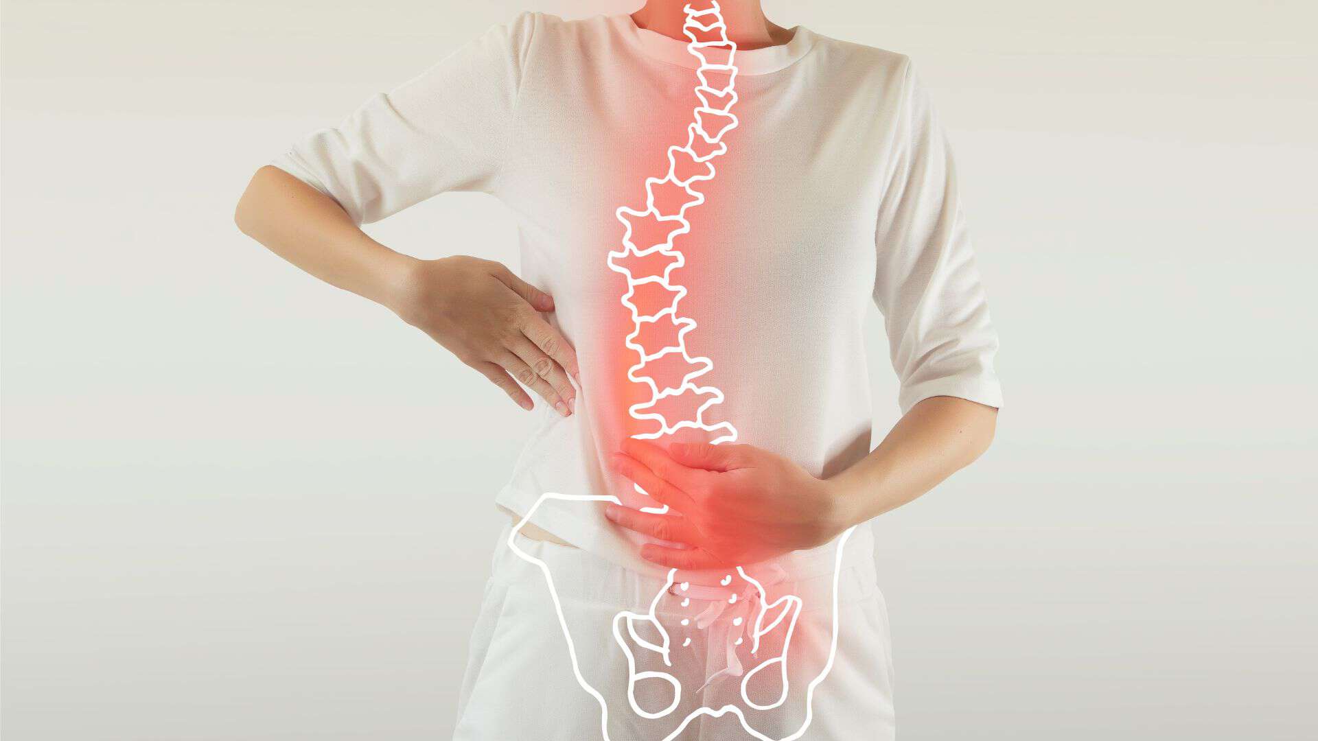 Person in white holds their back, with an illustrated spine overlaid showing curvature and red highlights, suggesting discomfort or pain. This emphasizes the importance of physical therapy NYC for effective relief and pain management.