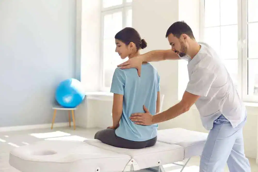 A spinal specialist in NYC evaluating a patient with spinal stenosis, offering expert diagnosis and advanced treatment options for chronic back and nerve pain.