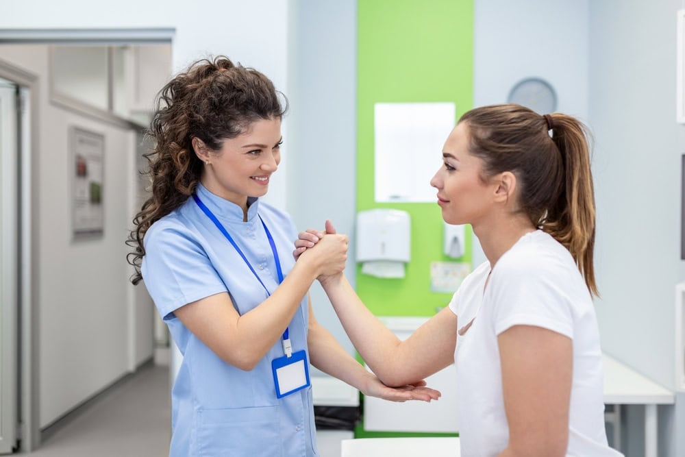 Neuropathy specialist in NYC consulting with a patient about chronic nerve pain, offering expert diagnosis and personalized treatment plans for effective pain relief.